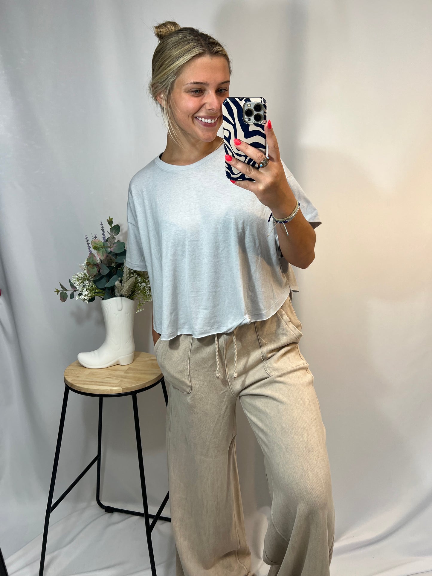 Neutral beige wide leg sweatpants styled with oversized tee – cute outfit idea for laid-back days