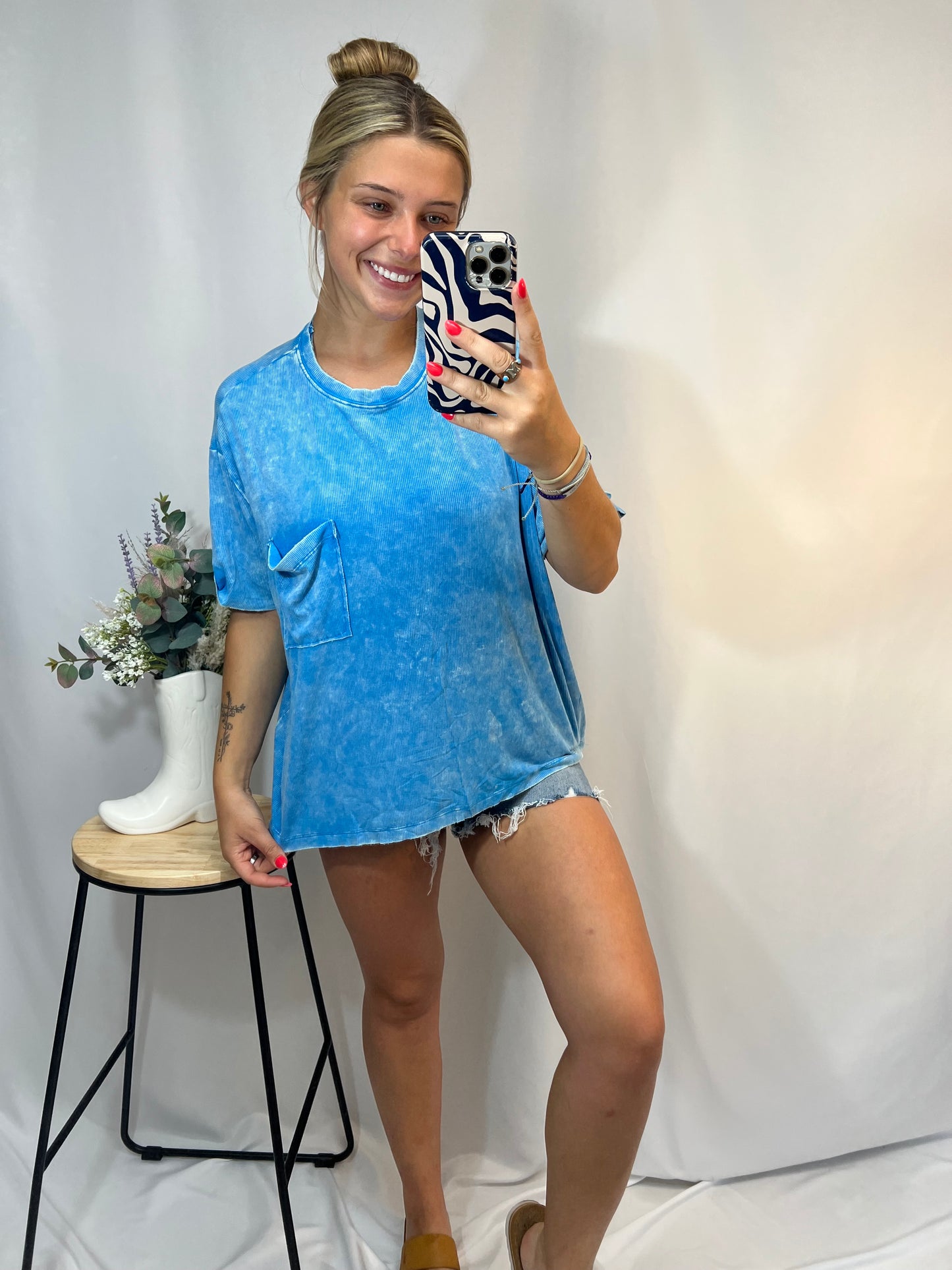 Laid-back style sky blue tee with chest pocket and relaxed silhouette
