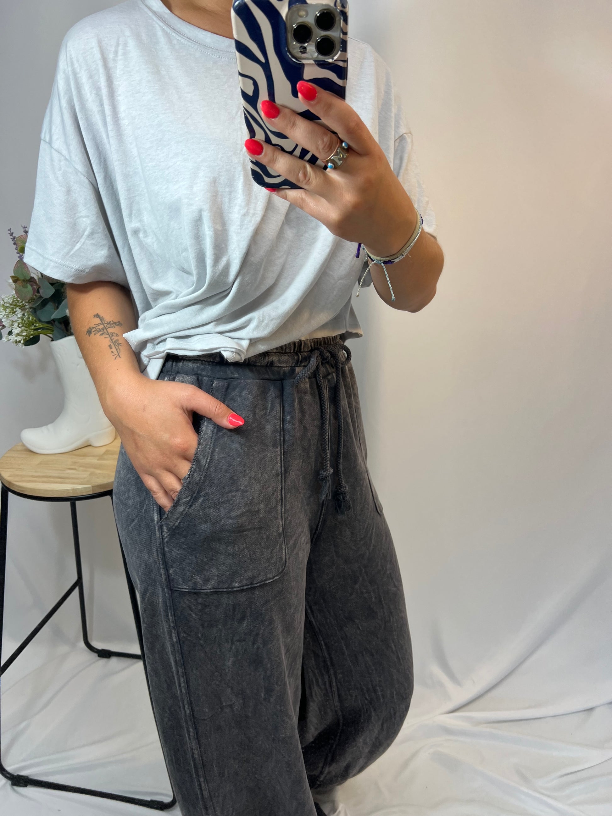 Side profile of charcoal grey wide leg French terry sweatpants with relaxed fit and vintage style finish