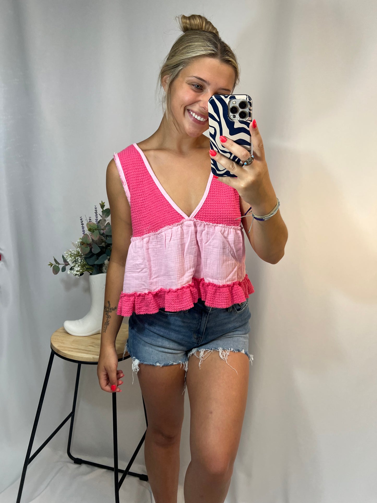 Hot pink and light pink two-tone cropped babydoll top with deep v-neckline