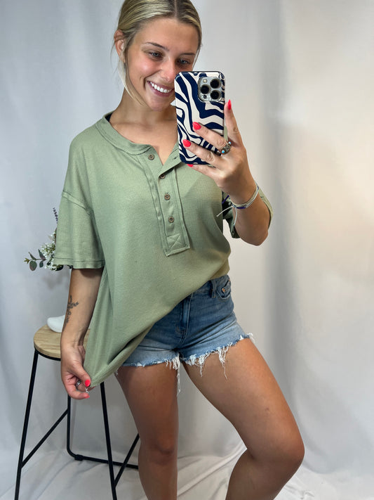 Trendy sage green Henley top styled with denim shorts — cozy waffle knit tee for girls shopping cute summer outfits