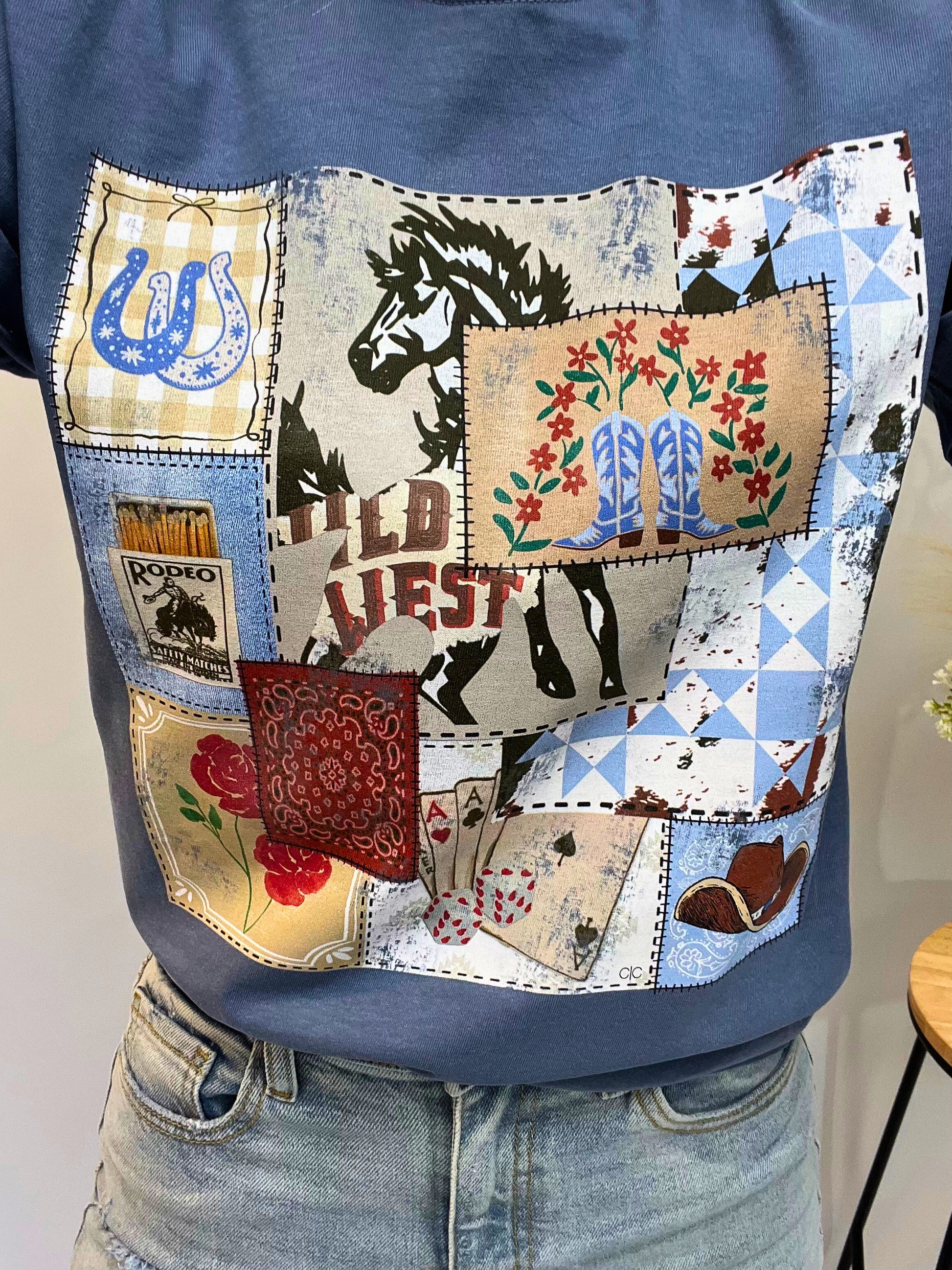 Close-up of Rodeo Patch Tee’s vintage rodeo stamps graphic print on soft cotton — western tee for girls with cute cowgirl style.