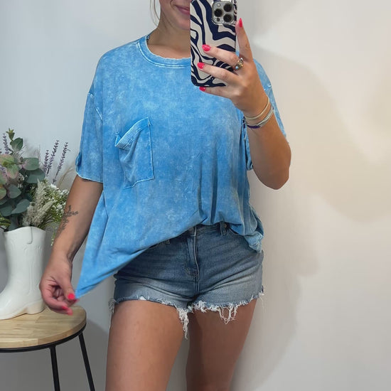 Laid-back style sky blue tee with chest pocket and relaxed silhouette