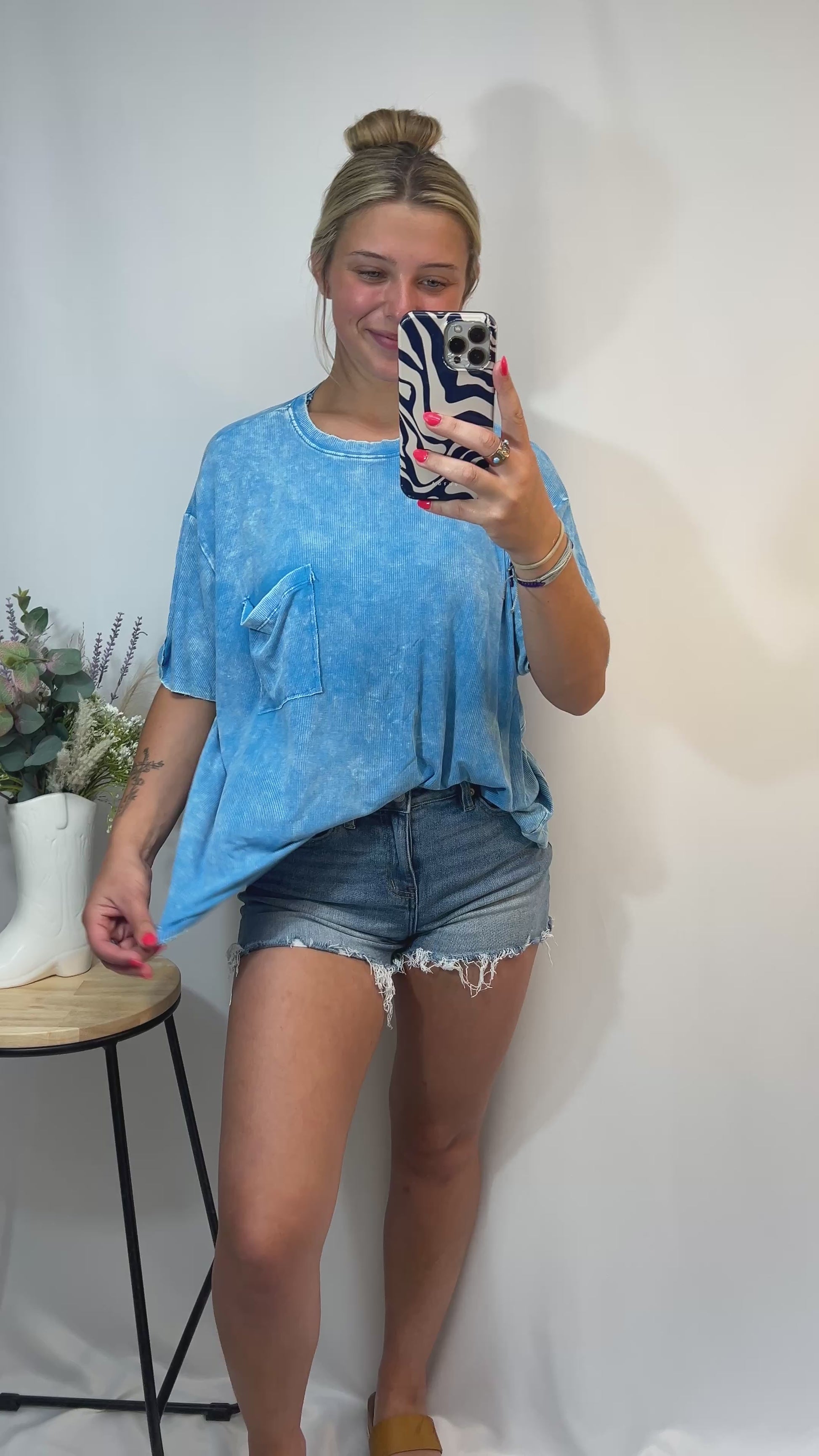 Laid-back style sky blue tee with chest pocket and relaxed silhouette