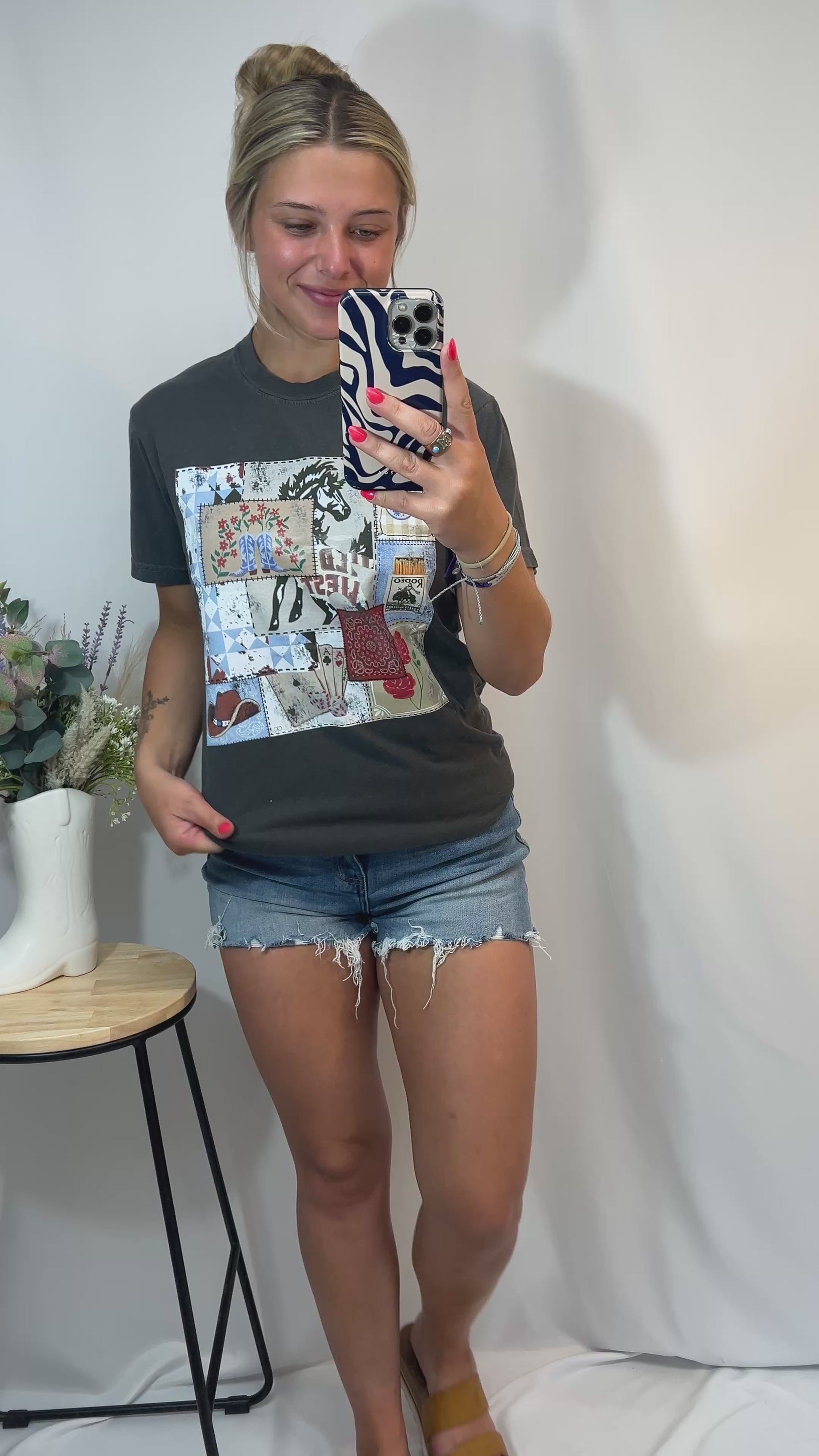 Video of Rodeo Patch Tee in Graphite shown in a full 360 mirror try-on — relaxed western graphic t-shirt outfit for summer.